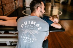Physical therapist providing hands-on treatment to a patient