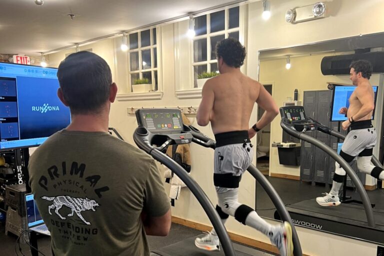 Patient walking on a treadmill during gait analysis training