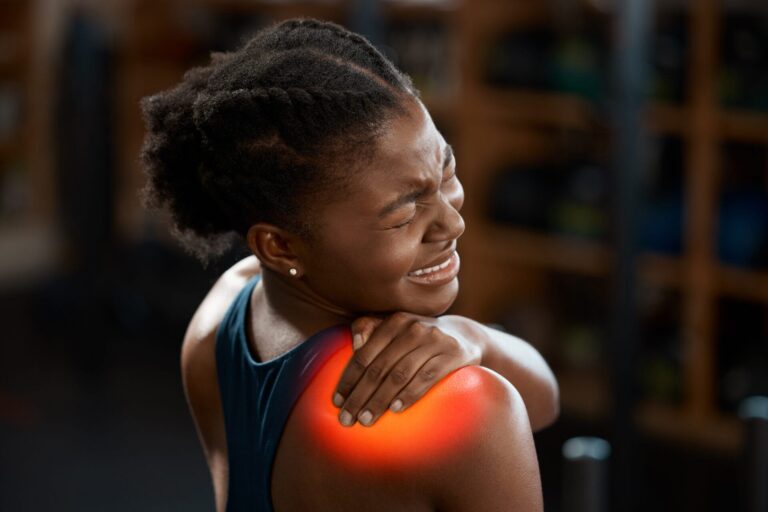 Woman experiencing shoulder pain