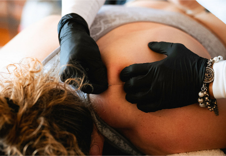 Physical therapist providing hands-on treatment to a patient