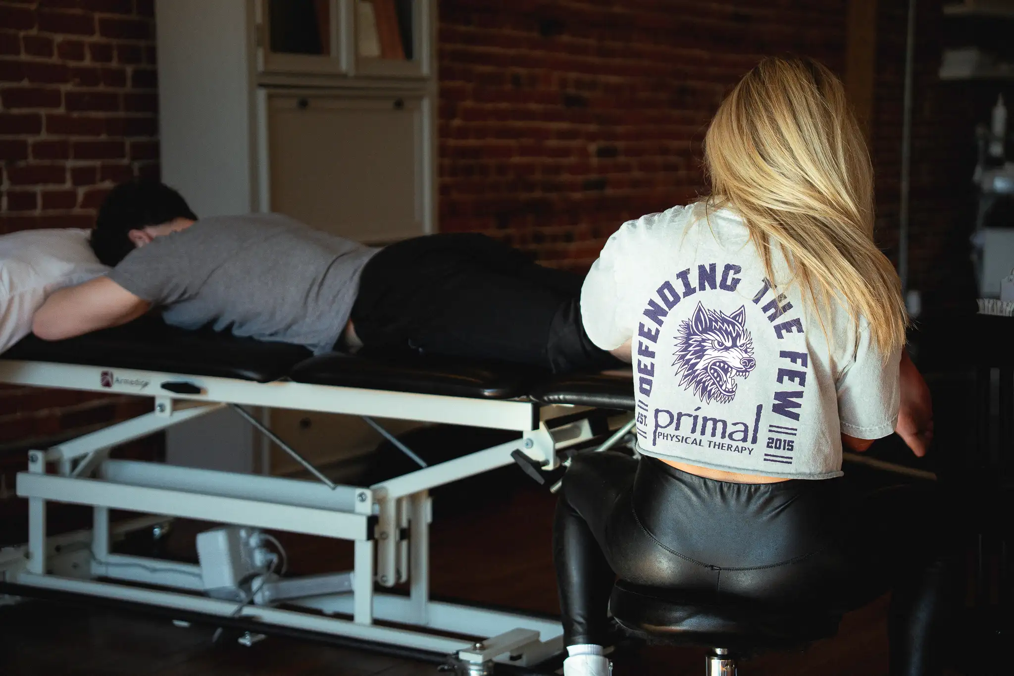 Dr. Eric Abramowitz, TPI Medical Level 2 Certified Physical Therapist, evaluating a patient's movement.