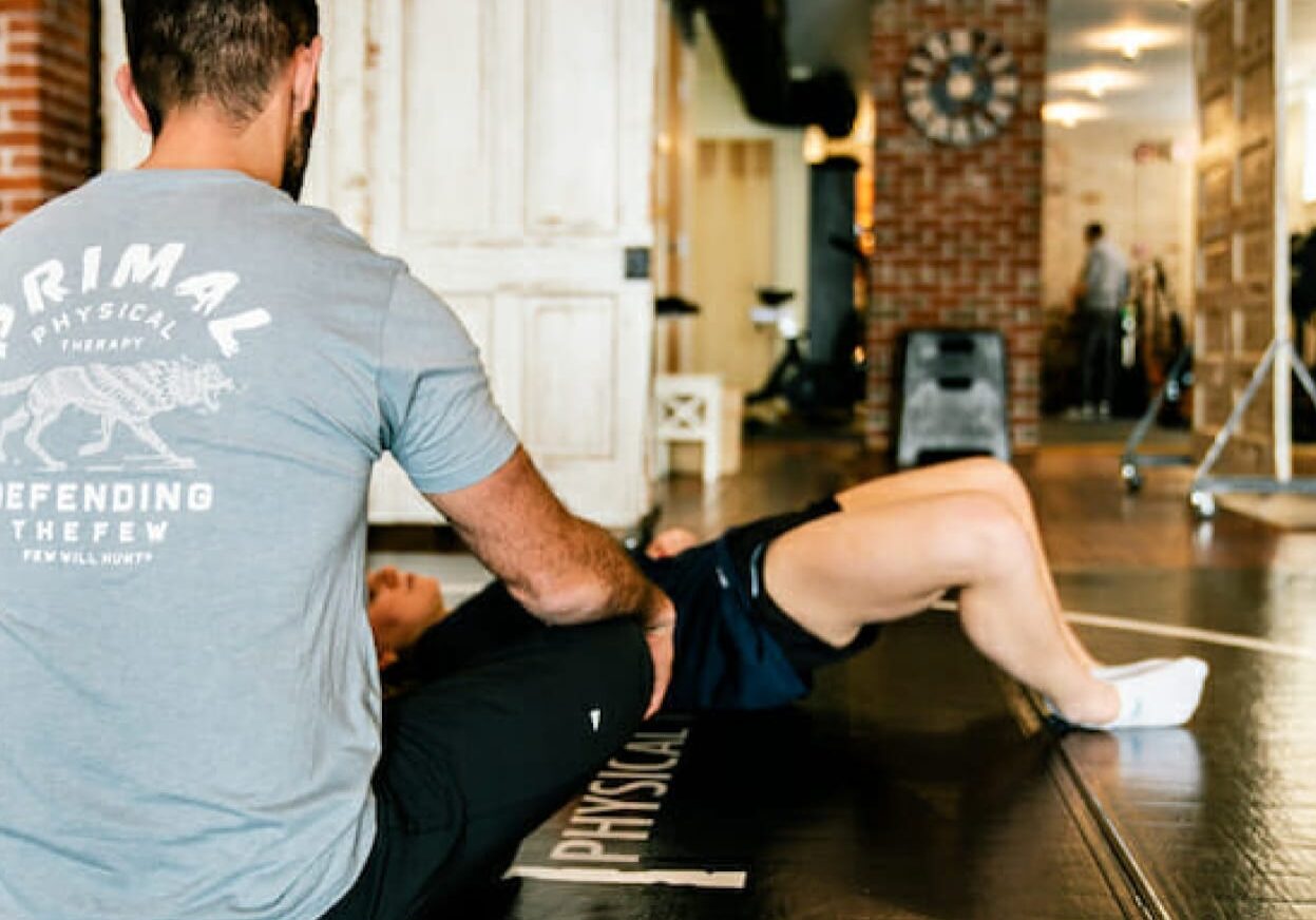 Sports Rehabilitation Dr. Eric Abramowitz providing specialized sports therapy to a client, focusing on targeted treatment techniques to enhance recovery and performance.