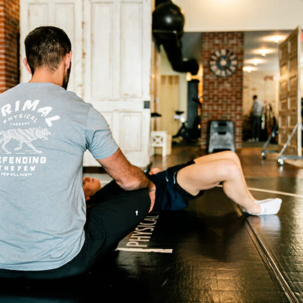 Sports Rehabilitation Dr. Eric Abramowitz providing specialized sports therapy to a client, focusing on targeted treatment techniques to enhance recovery and performance.