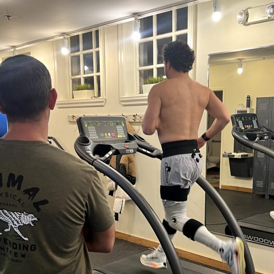 gait featured Dr. Eric Abramowitz monitoring gait analysis to an athlete